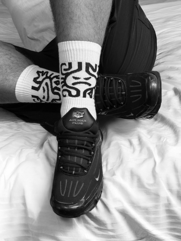 SniffAIR CUM CUNT in the bed Socks SniffAIR CUM CUNT socks on model – lifestyle fetish photography